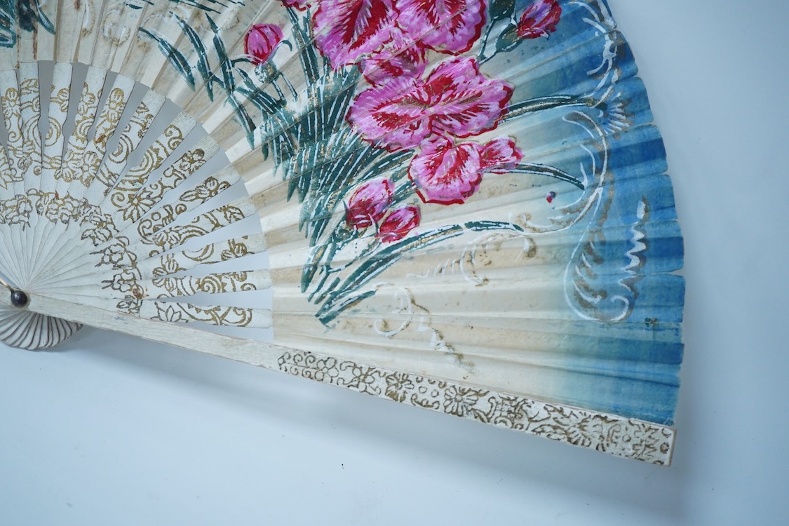 A collection of 19th century and later fans to include a black lacquered and lace example and a hand painted floral example